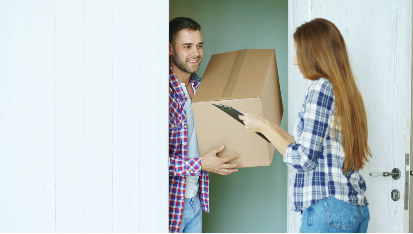 Delivery person handing a package to a customer at their door